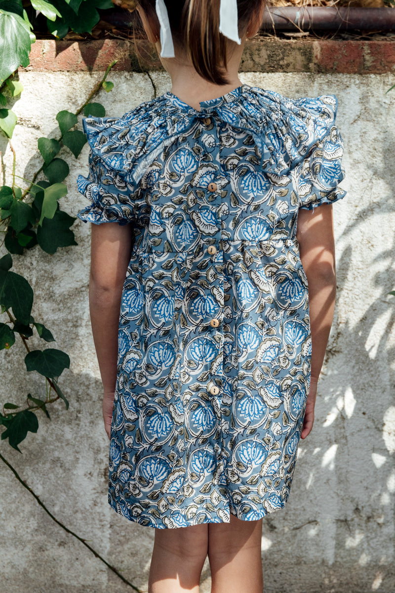 Dress with blue floral stitching on the collar