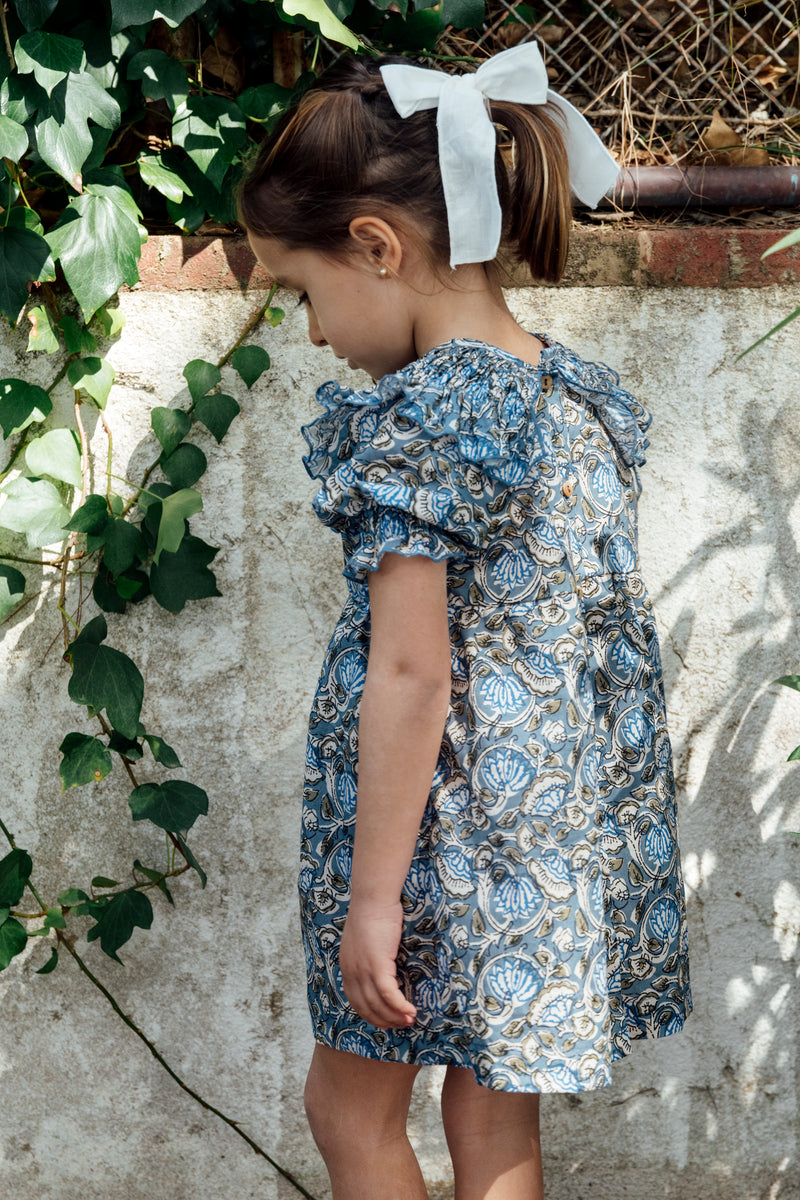 Dress with blue floral stitching on the collar