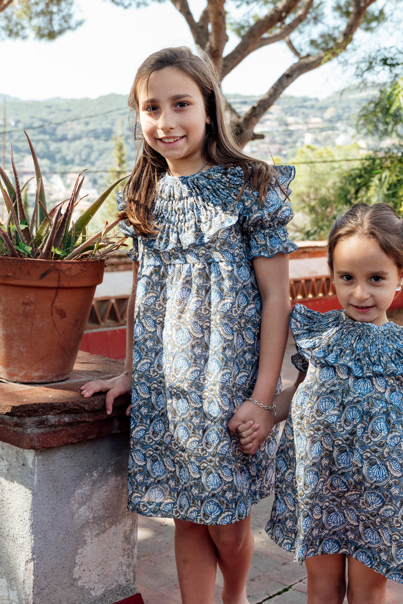 Dress with blue floral stitching on the collar