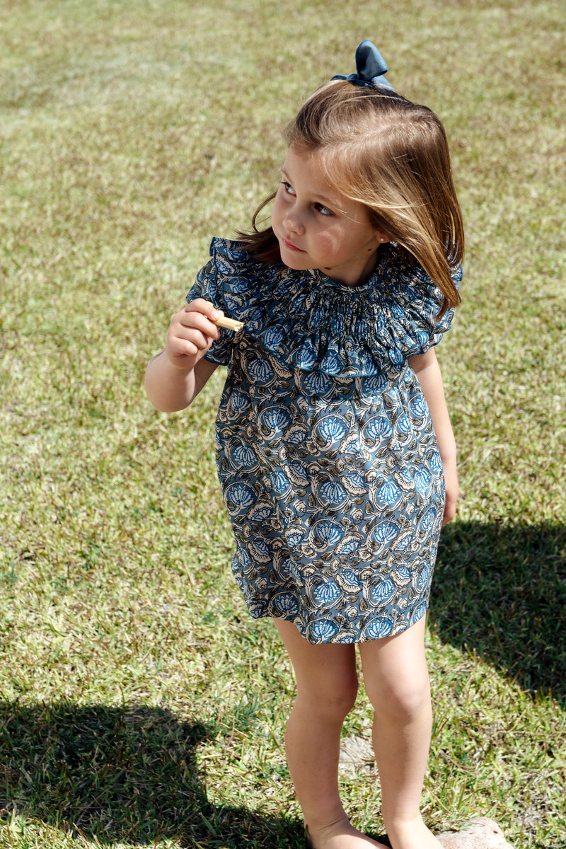 Dress with blue floral stitching on the collar